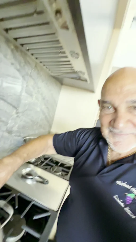 Michael Martorana smiling in his kitchen