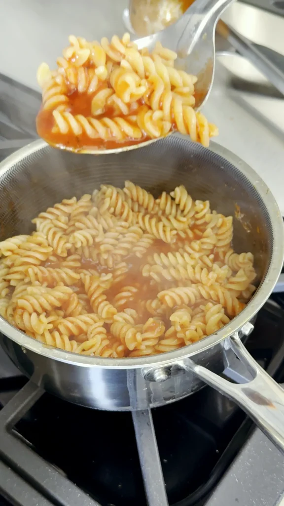 Rotini tossed in Michael's sauce, lifted from the pan